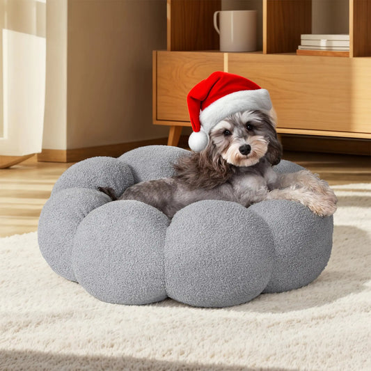 Cozy grey dog bed with cloud design – small dog wearing Christmas Santa hat resting on soft round pet cushion