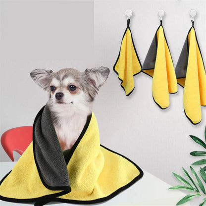 Small dog wrapped in yellow and black microfiber pet towel, quick-dry absorbent towel for pets with hanging hooks, ideal for dog grooming and bath time