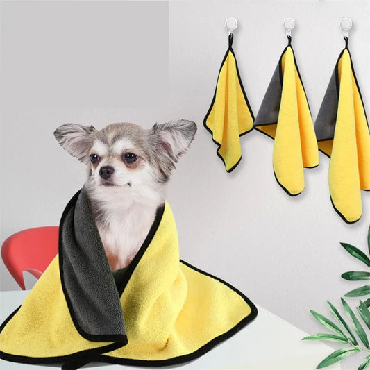 Small dog wrapped in yellow and black microfiber pet towel, quick-dry absorbent towel for pets with hanging hooks, ideal for dog grooming and bath time