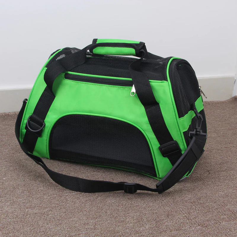 Green and black portable pet carrier bag with mesh ventilation, shoulder strap, and handles – travel carrier for cats and small dogs