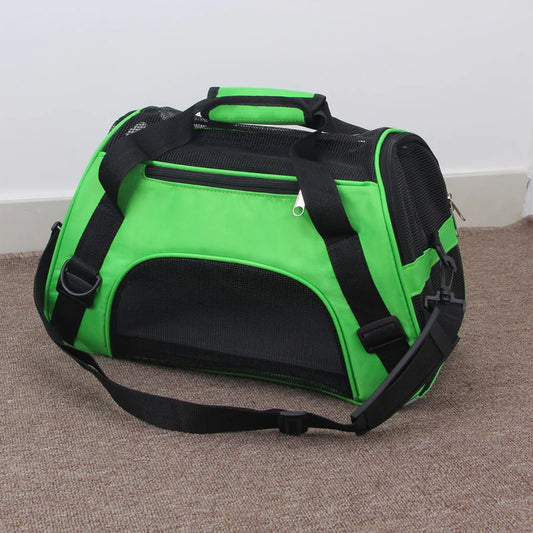 Green and black portable pet carrier bag with mesh ventilation, shoulder strap, and handles – travel carrier for cats and small dogs