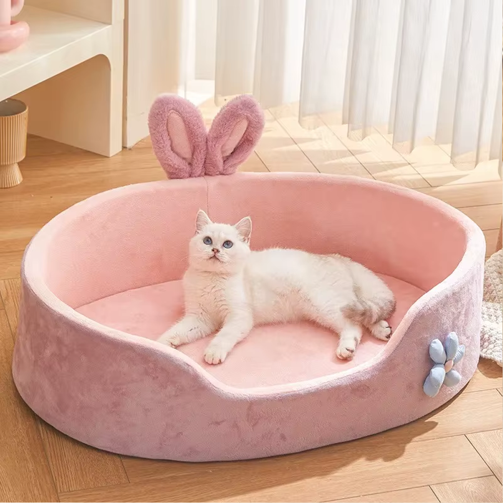 Soft pink cat bed with bunny ear design – cozy plush kitten bed with raised sides for small pets