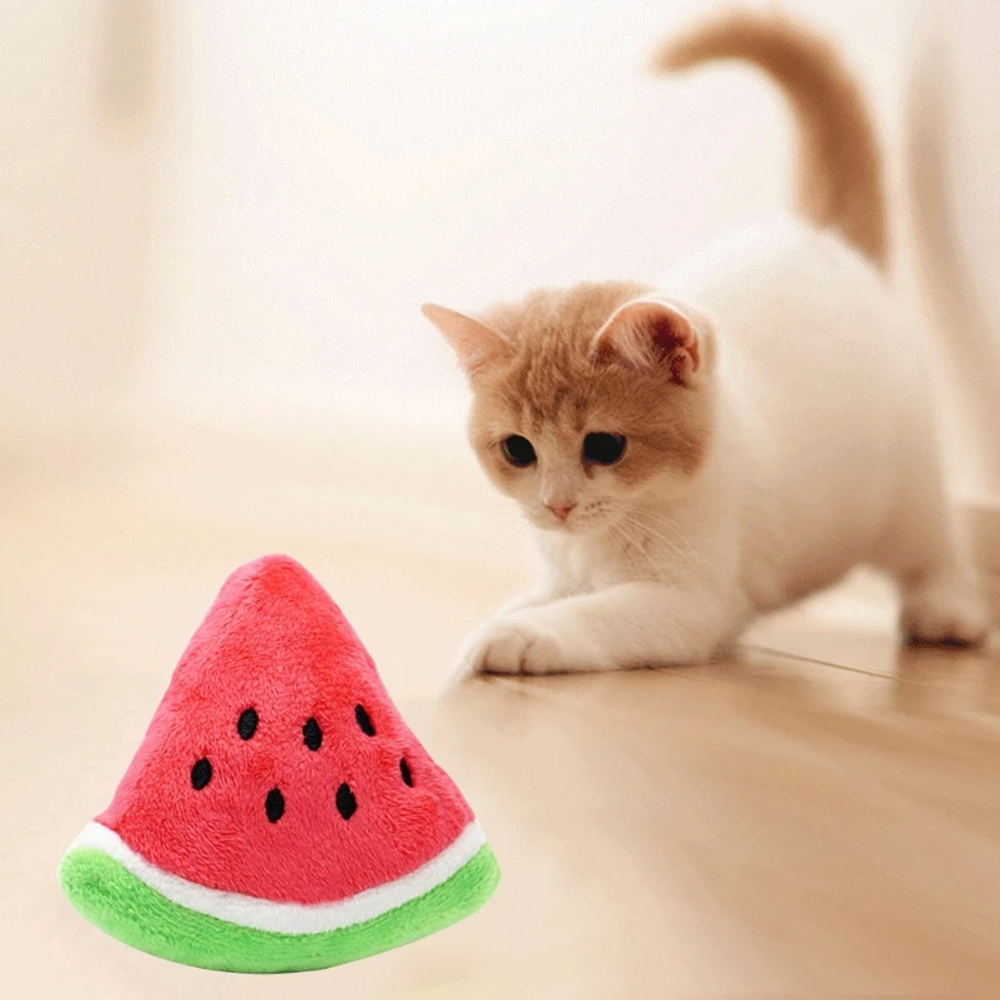 Cat playing with watermelon plush toy – soft interactive chew toy for cats, fun fruit-shaped kitten plaything with catnip option
