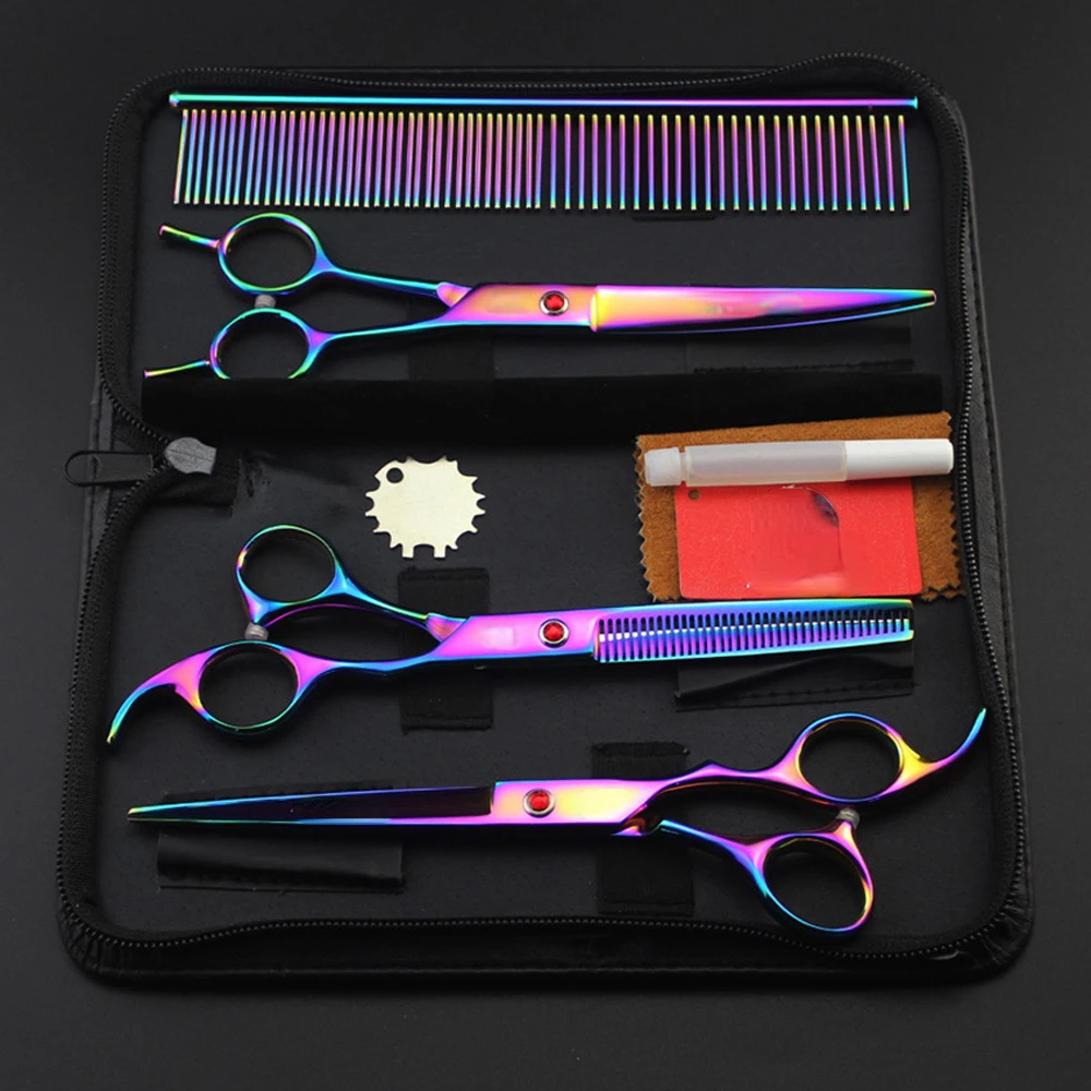 Professional pet grooming scissors set with rainbow finish, including straight scissors, thinning shears, curved shears, comb, and accessories in a black carrying case